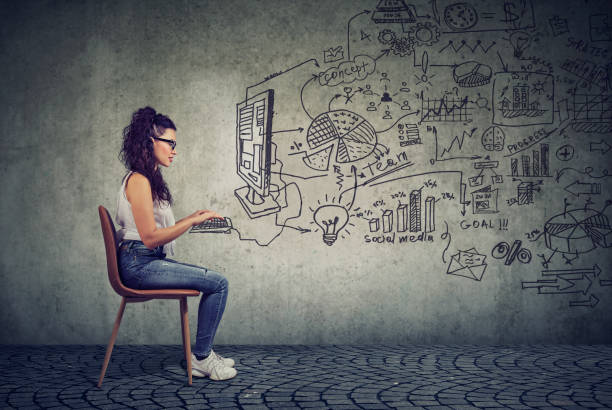 istock Hipster young business woman working in an office on computer 958082356