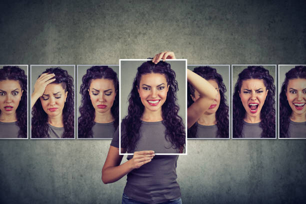 mujer enmascarada expresando diferentes emociones - behavior fotografías e imágenes de stock