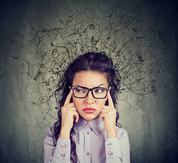 istock stressed young woman with a mess in her head 958082466
