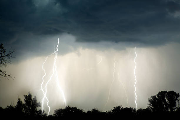 istock Lightning in the night with red sky during stormy weather 958083388