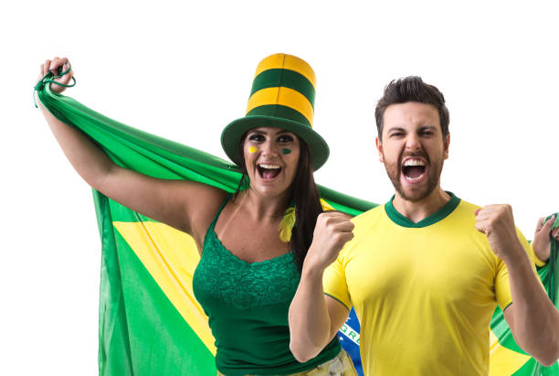 istock Brazilian couple fan celebrating on white background 958090136