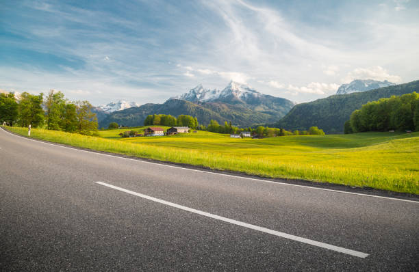 istock Empty asphalt country road with alpine mountain scenery in summer 958091814