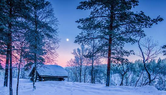 Winter wonderland in Scandinavia at sunset