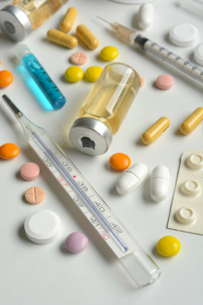 istock pile of generic drugs on white table - closeup 958095132