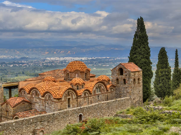 Byzantine monastery in Mystras Peloponnese Greece Monastery buildings in the medieval Byzantine ghost town-castle of Mystras, with city of Sparta in background Peloponnese, Greece sparta greece photos stock pictures, royalty-free photos & images