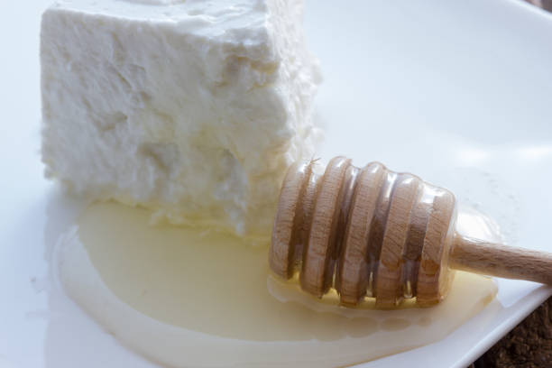 istock Tasty fresh cow Ricotta cheese with honey 958122004