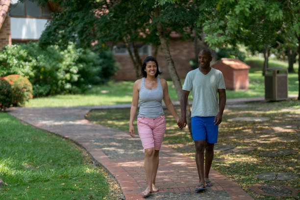 istock Diverse couple taking a walk outdoors around the hotel looking very happy 958126618