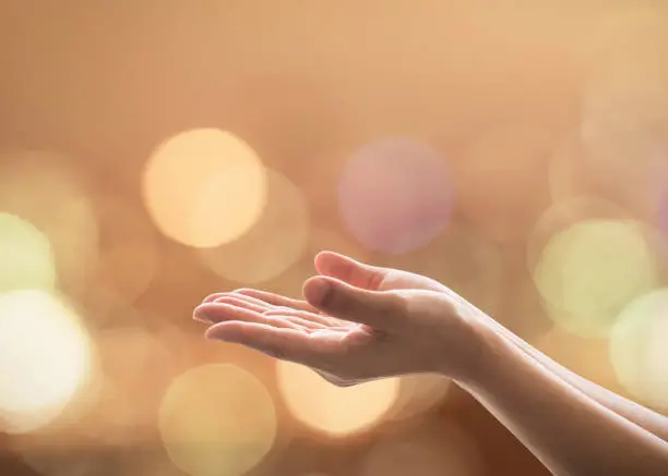 Photo of Empty female women open human hand prayer palms up Candle night light natural warm gold lantern bokeh Pray support aid destiny help peace campaign: Holy spirit week: World religion day: Eid mubarak