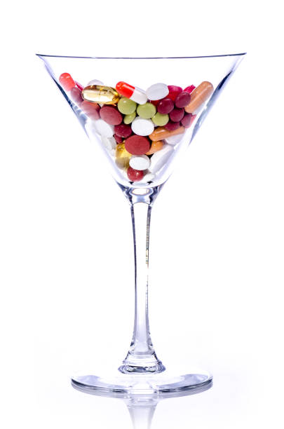 istock pills in a cocktail glass 958132168