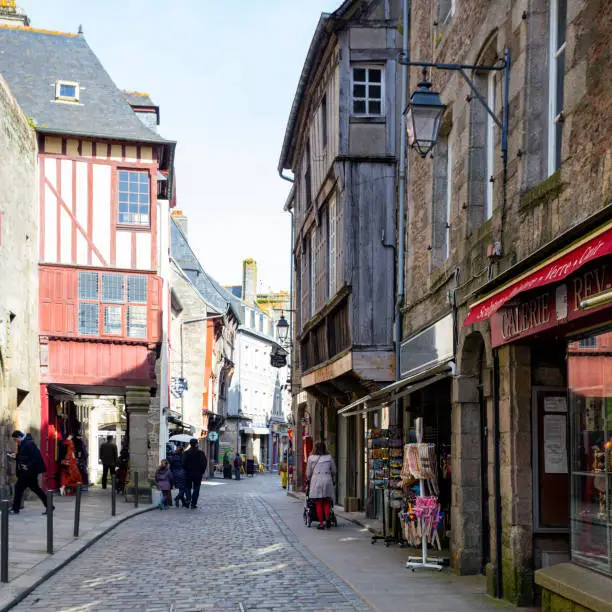 DINAN, FRANCE - APRIL 6, 2018: beautiful streets with colombage houses in the famous city of Dinan. Normandy, France