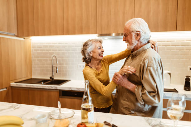 istock senior couple dancing in the kitchen 958139920