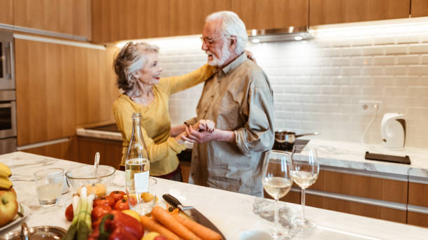 istock senior couple dancing in the kitchen 958139952