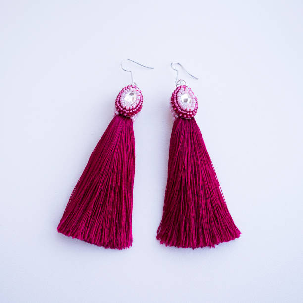 istock Handmade pink earrings-brushes with beads. 958140320