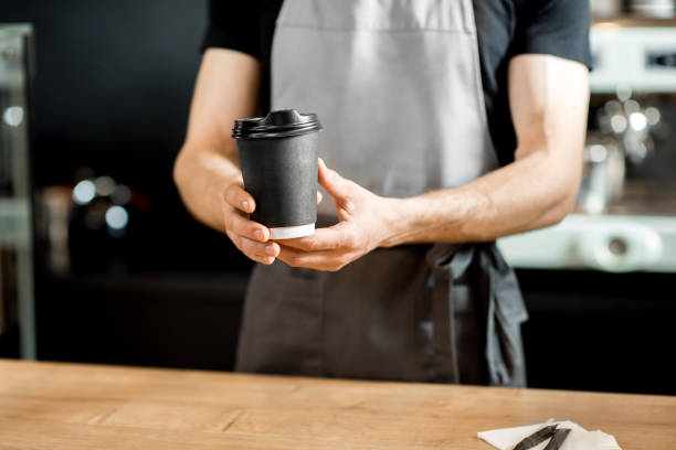 istock Barista holding coffee cups indoors 958147088