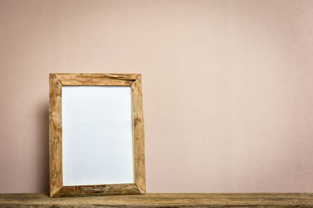 istock Rustic wooden photo frame on shelf. 958147102