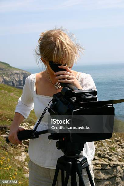 Camera Woman At Work Filming Outdoors Stock Photo - Download Image Now - Film Director, Women, 30-39 Years