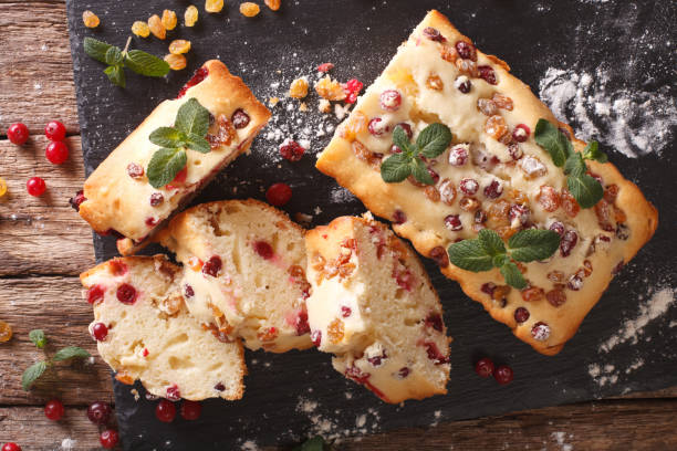 istock sliced fruit cake with cranberries and raisins decorated with mint close up. horizontal top view 958159708