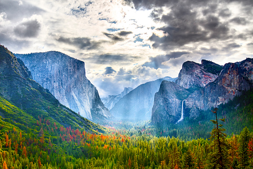 Clouds parting over tunnel view in Yosemite National Park with El Capitan & Bridal Veil Falls