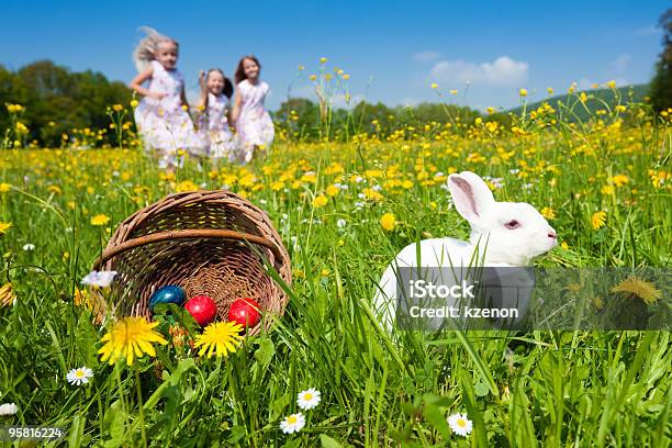 Easter Bunny Watching The Egg Hunt Stock Photo - Download Image Now - Child, Easter Egg Hunt, Easter Bunny