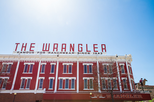 CHEYENNE, WYOMING - APRIL 27, 2018: View of The Wrangler in historic downtown Cheyenne Wyoming.  The Wrangler ranchwear store has been in business since 1943Cheyenne, Wyoming, USA - April  27, 2018: View of The Wrangler in historic downtown Cheyenne Wyoming.  The Wrangler ranchwear store has been in business since 1943