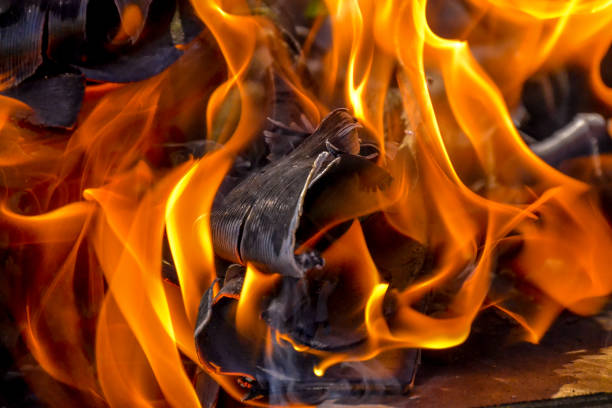 Abstract background of fire, coals, flames and twisting elements of ash