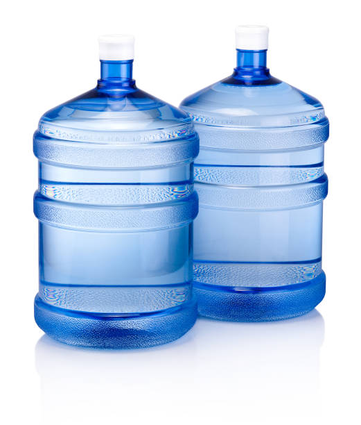 istock Two big blue plastic cooler bottle for potable water isolated on a white background 958169740