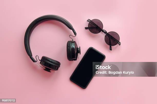 Stylish Black Sunglasses Smartphone And Headphones On Pink Background Flat Lay Modern Hipster Image Black Items On Pink Paper Instagram Blogging Space For Text Summer Vacation Stock Photo - Download Image Now