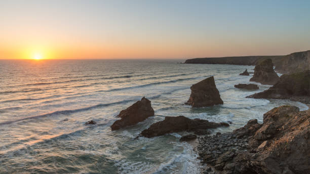 istock Beautiful dusk sunset landscape image of Bedruthan Steps rock stacks on West Cornwall coast in England 958172732