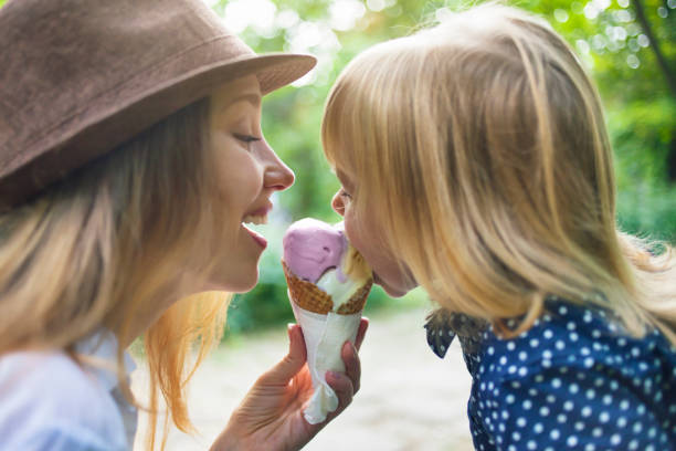 istock Mother and child eating ice cream 958174468