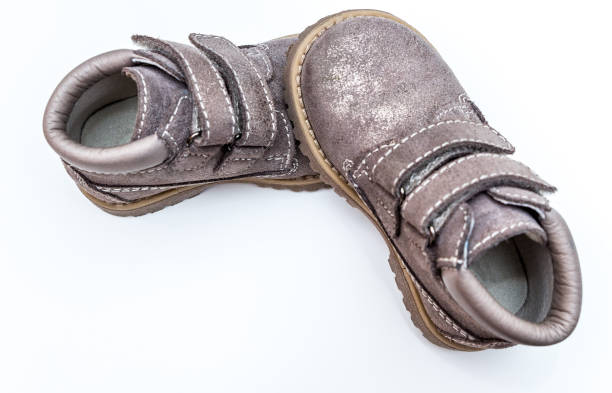istock Children shoes in gray color 958174596