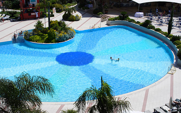 istock swimming pool at sunny hotel 95817566