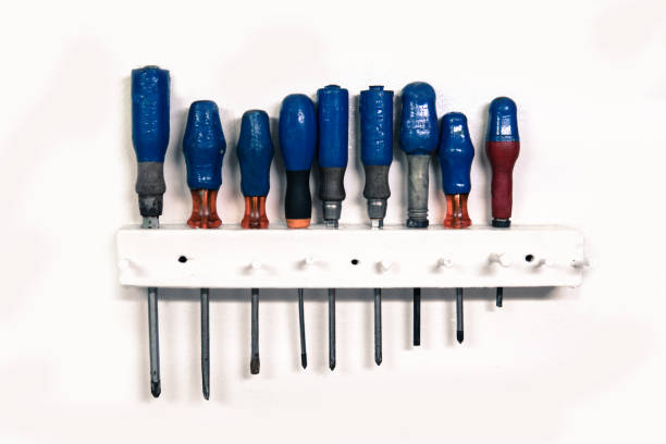 set of old screwdriver tools on white background.