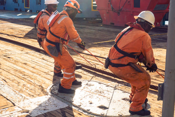 istock AHTS vessel doing static tow tanker lifting. Ocean tug job 958180580