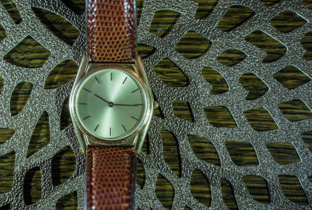 istock Modern men`s watch, brown-gold color 958185036