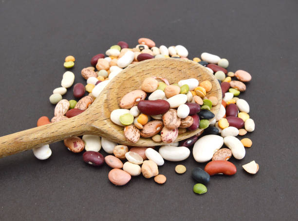 istock A mixture of legumes , black background. 958185296
