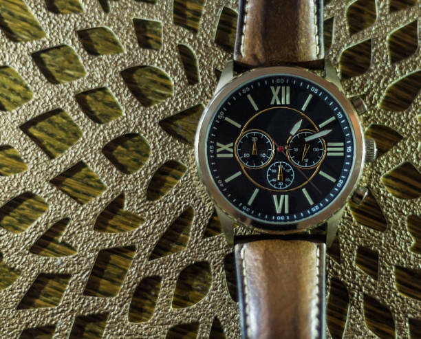 istock Modern men`s watch, brown-gold color 958185362