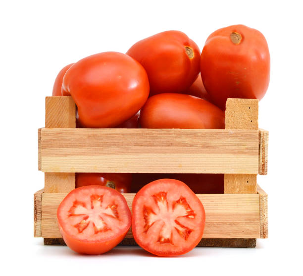istock fresh tomatoes in a wooden crate on a white background 958185534