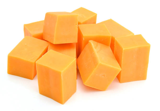 istock piece of cheese isolated on a white background 958185596