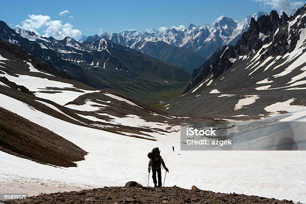 Hiker On A Rise Stock Photo - Download Image Now - Adult, Backpack, Blue