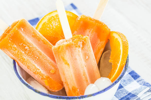 istock Orange Popsicles in Antique Bowl 958192884