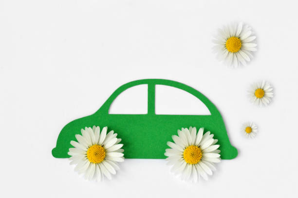 Paper car cut-out with daisy flowers - Ecolology car concept Paper car cut-out with daisy flowers on white background - Eco-friendly car concept alternative fuel vehicle stock pictures, royalty-free photos & images