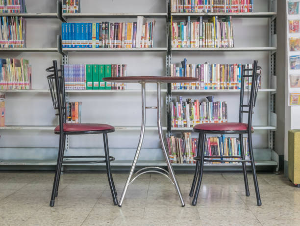 istock Table and chairs for reading in the library. 958196788