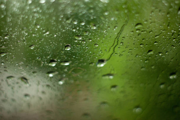 istock Close up of natural water drops on glass texture. 958199330