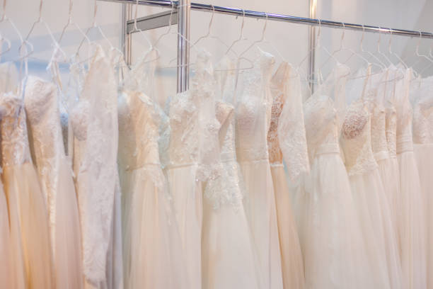 istock Rack with many beautiful wedding dresses. 958210194