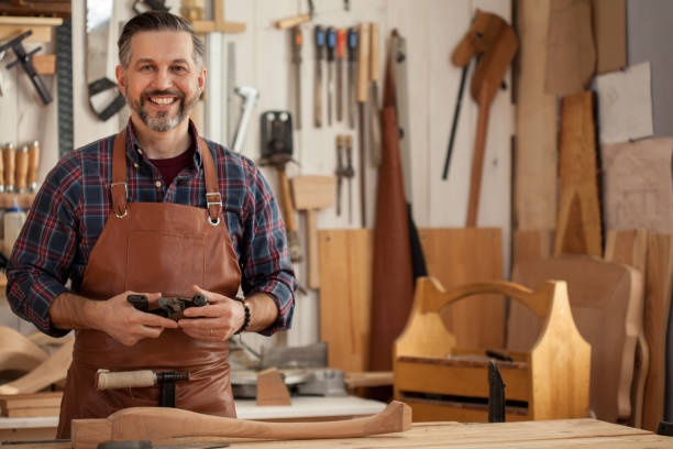 istock Joiner Makes Cabriole Leg for Vintage Table 958221122