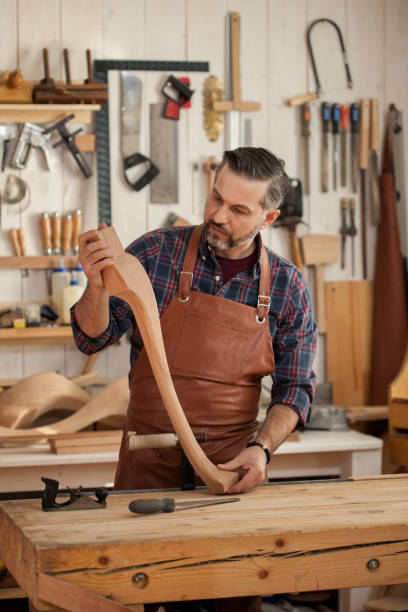 istock Joiner Makes Cabriole Leg for Vintage Table 958221132