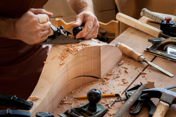 istock Joiner Makes Cabriole Leg for Vintage Table 958221512