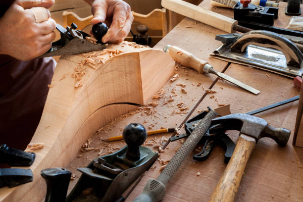 istock Joiner Makes Cabriole Leg for Vintage Table 958221520