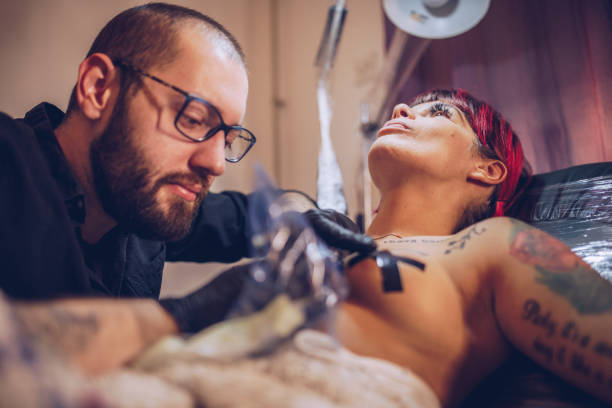 istock Young woman getting a tattoo 958221536