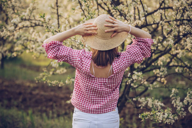 istock Brunette girl in orchard 958222420
